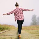 person balancing social energy