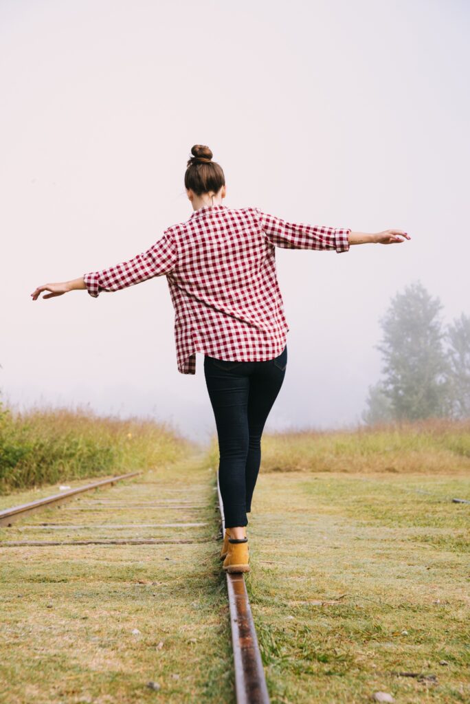 person balancing social energy